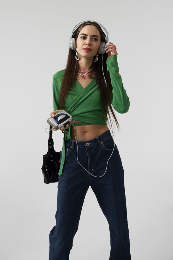 Y2K hairstyle and makeup inspiration including glittery eyeshadow, space buns, and glossy lips